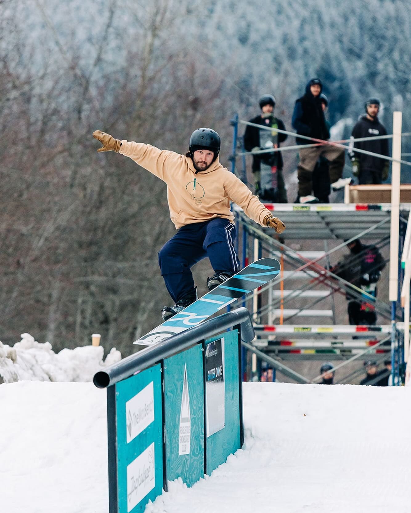 snowboarder on rail