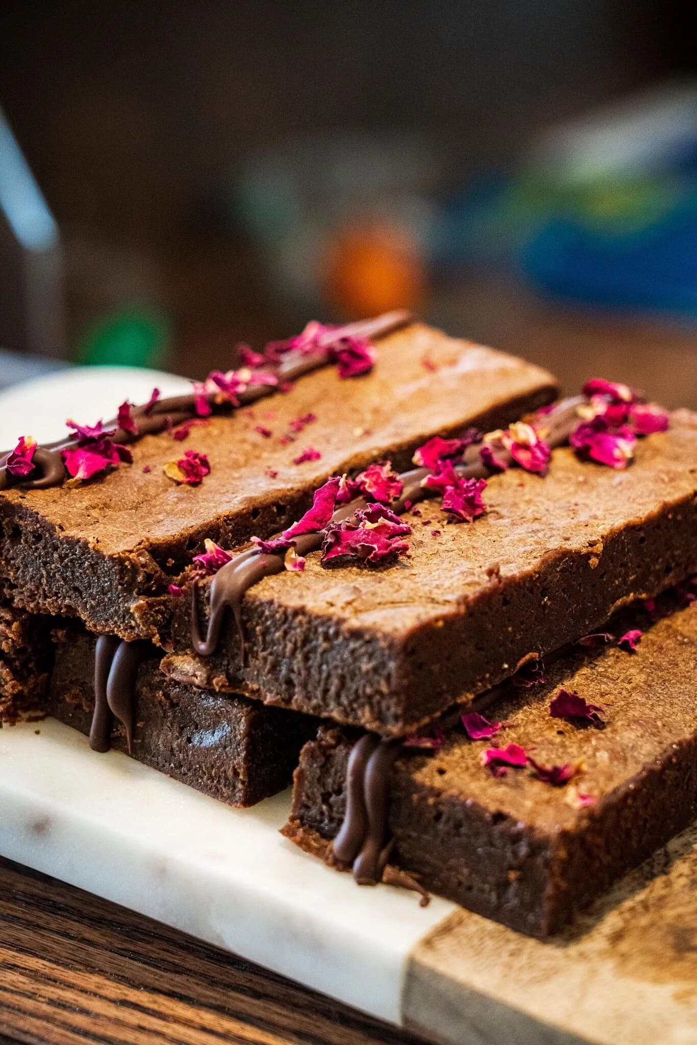 stack of brownies with dried flowers on top