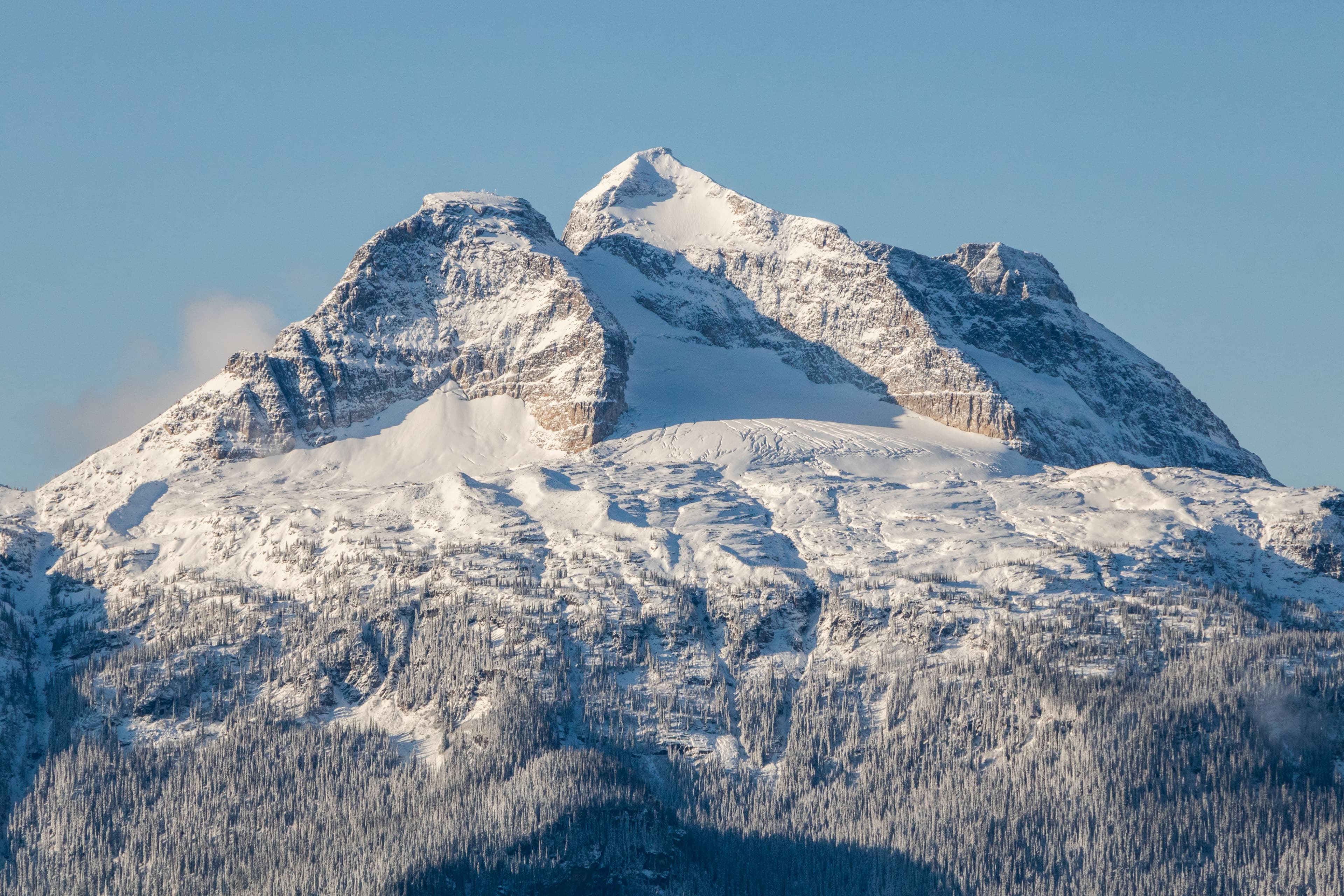 Snowy Mount Begbie with a blue sky background