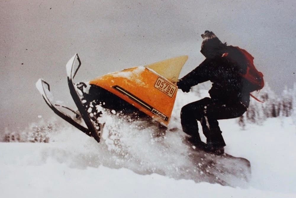 old school archive photo of snowmobiler