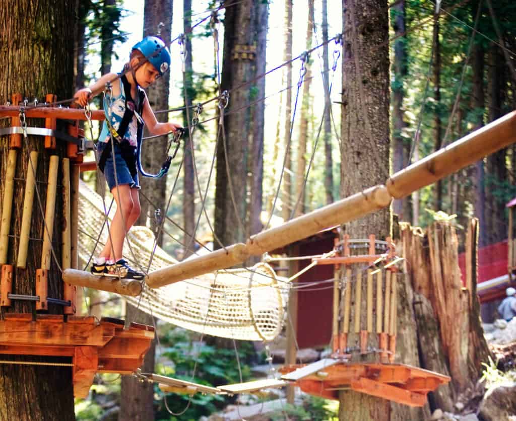 kid on forest obstacle course