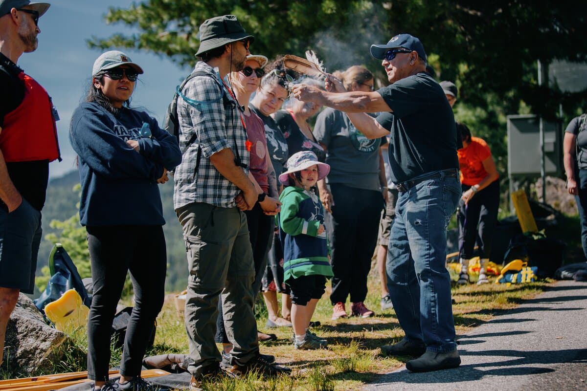 smudging group of paddlers before canoe journey