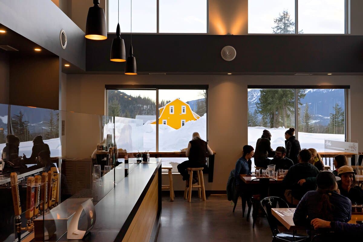 taproom of local brewery with yellow barn in window view