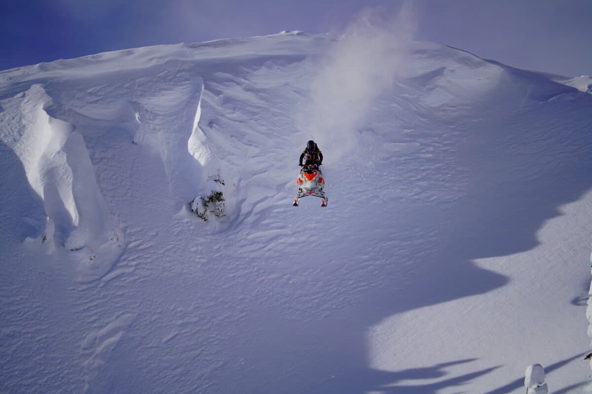 snowmobiler hitting huge drop