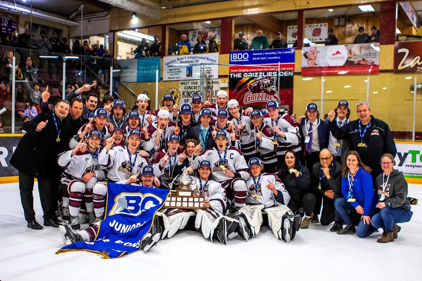 hockey team championship group photo on hockey ice