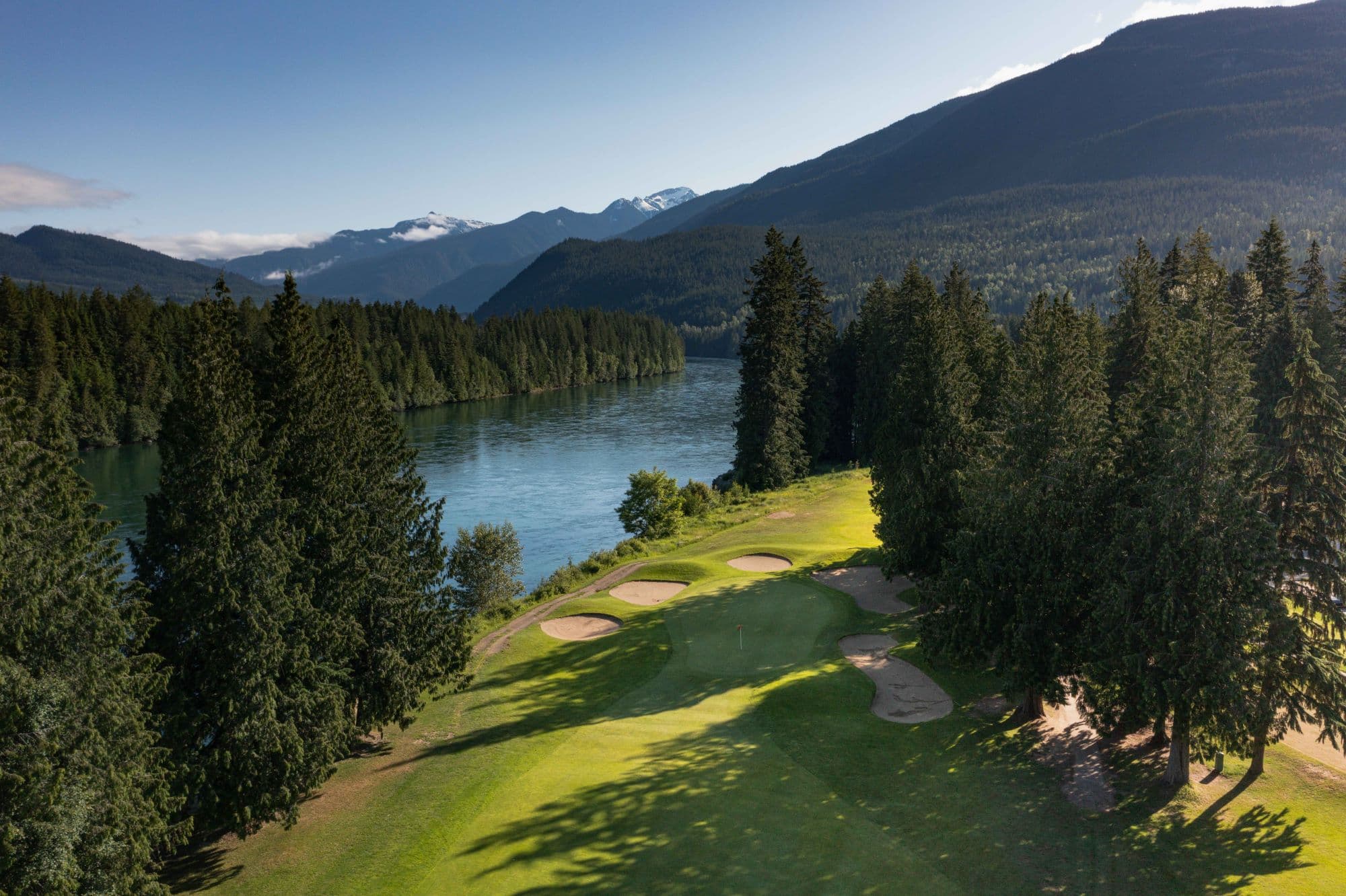 ariel view of golf course along water