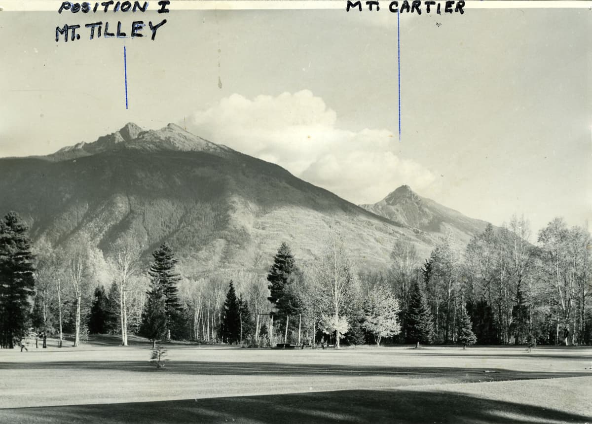 photo scan of mountains surrounding golf course