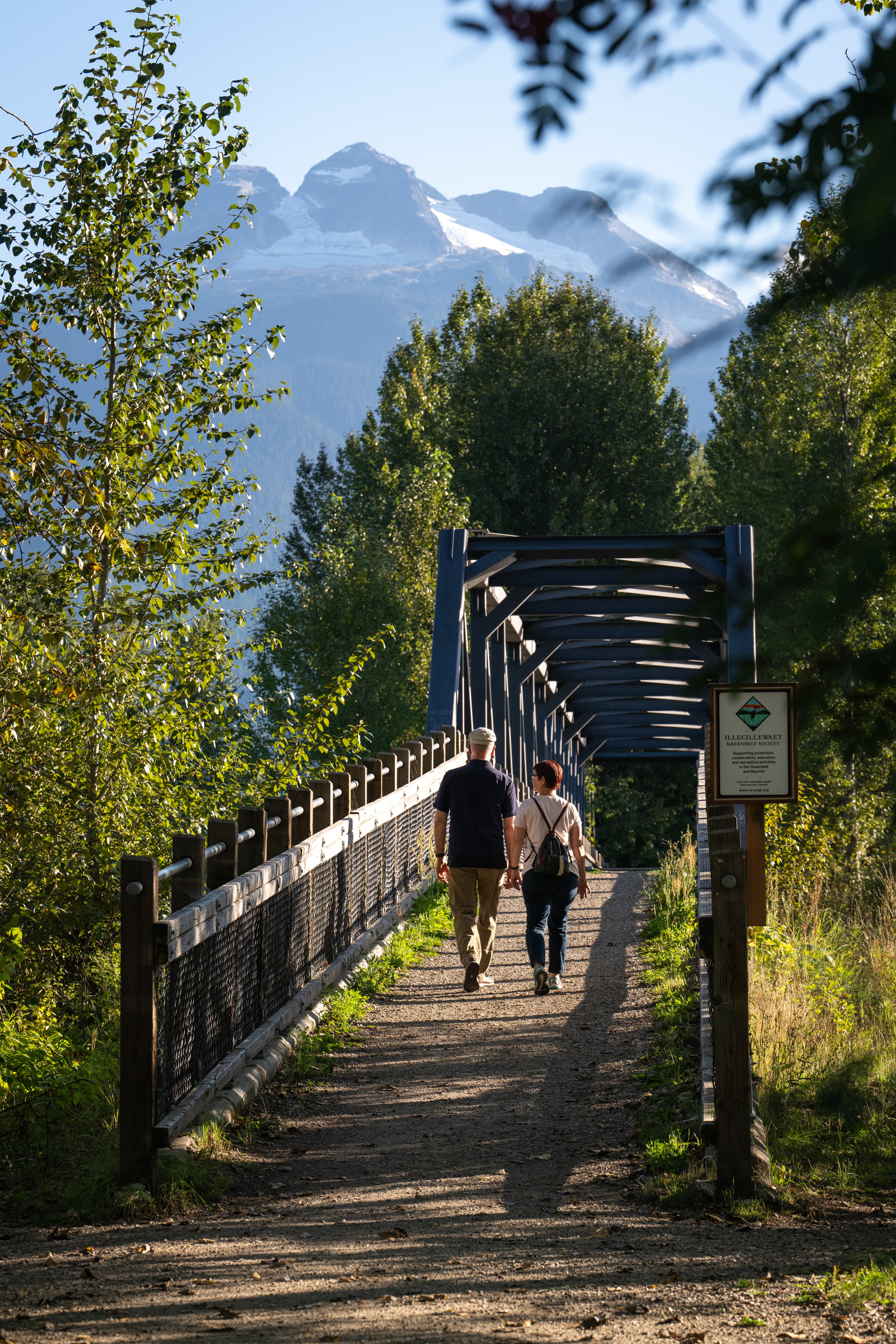 couple walking along bridge