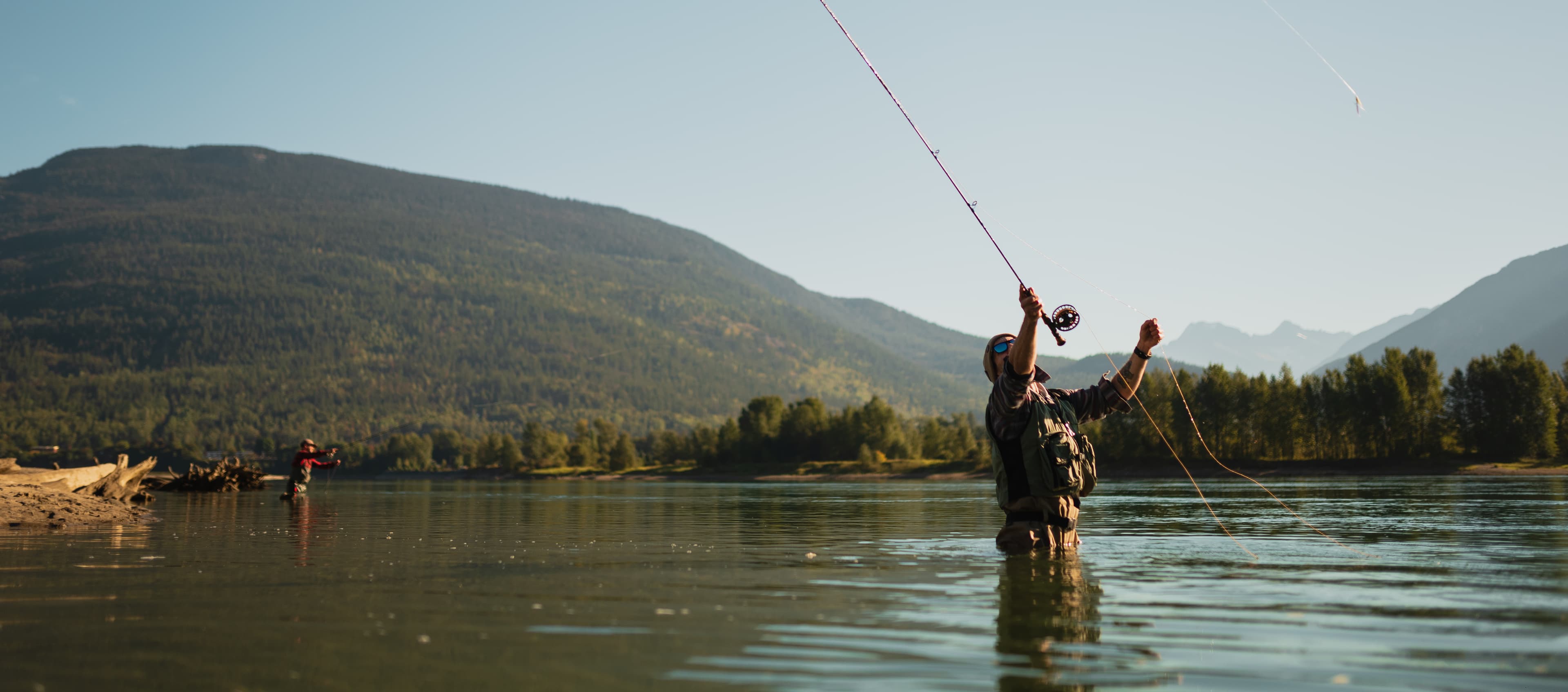two men casting out fly fishing