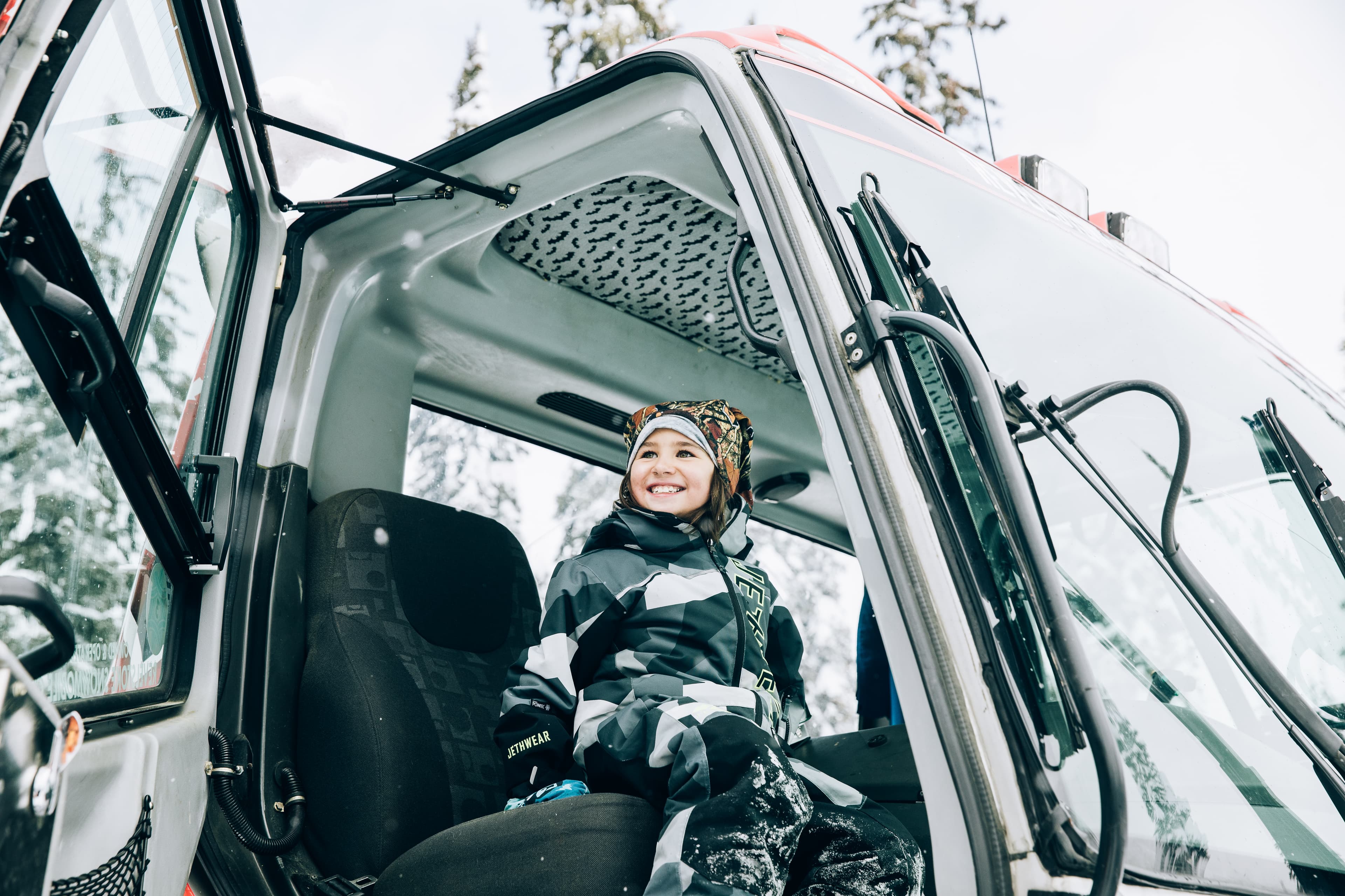 kid sitting in snowcat