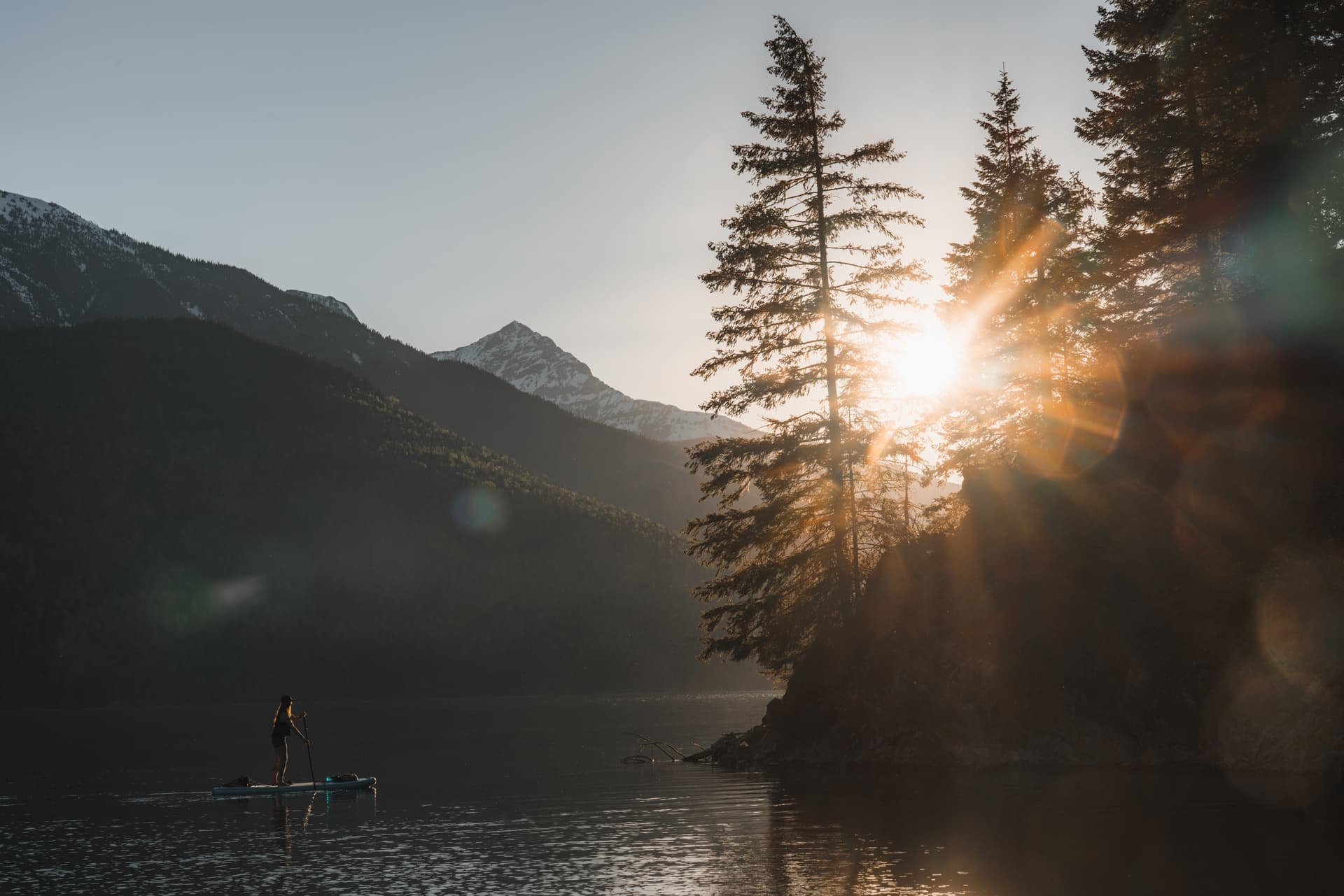 girl on paddleboard at inlet