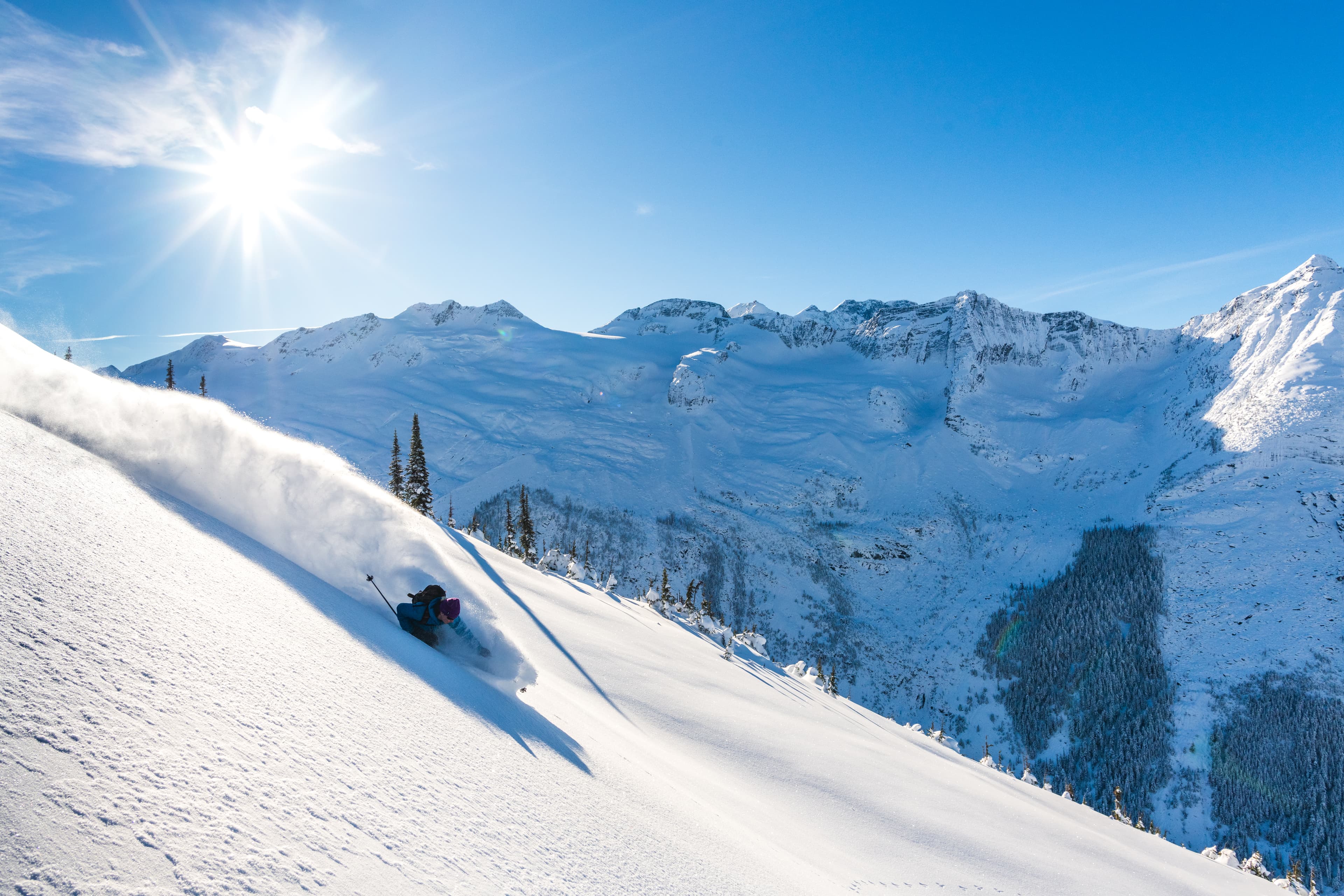 backcountry skier on blue bird day