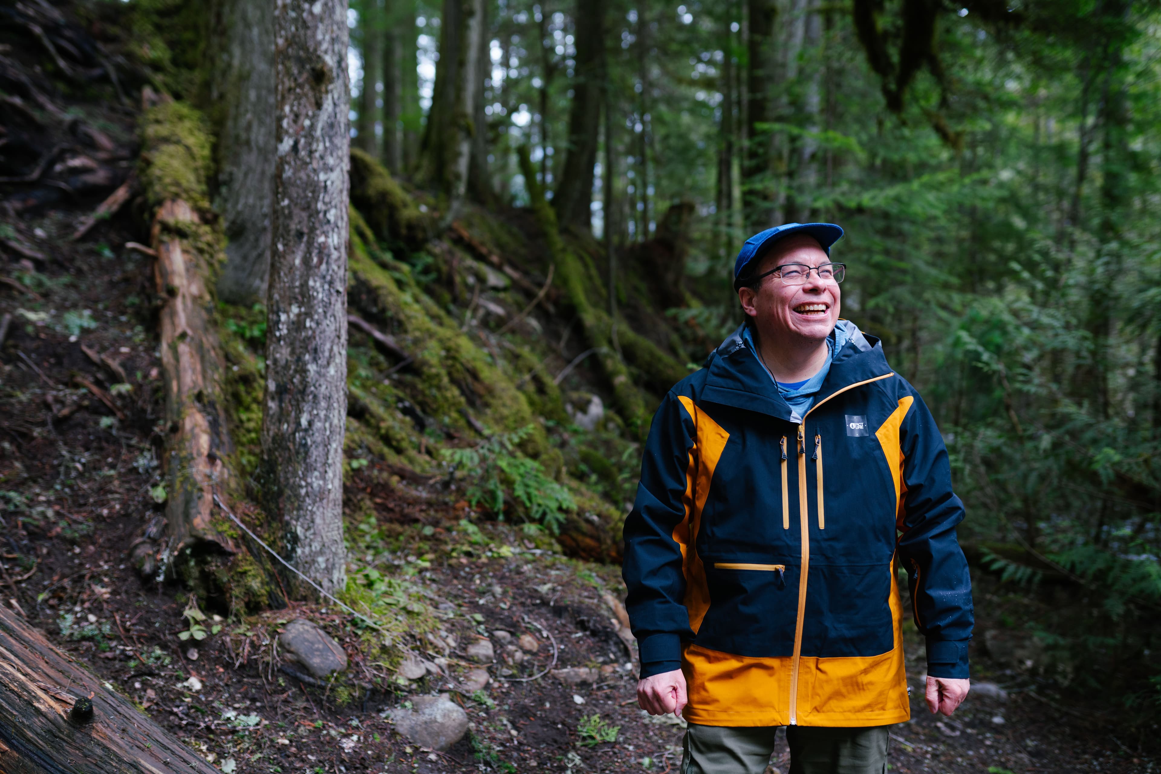hiking guide walking in rainforest