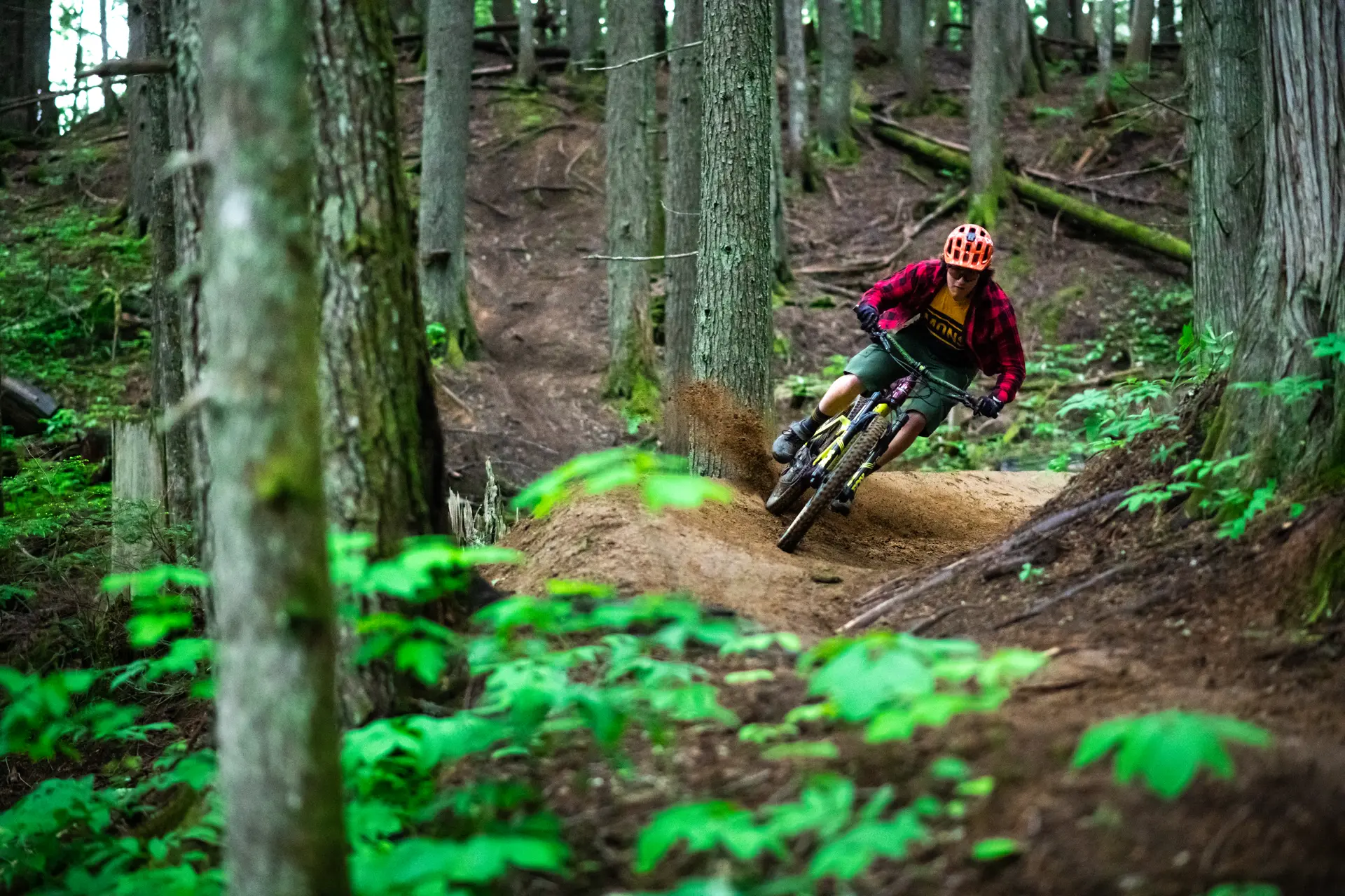 guy on mountain bike on berm