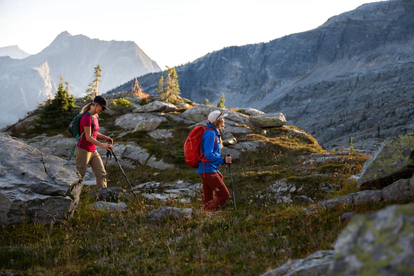 two girls hiking at dusk in alpine