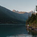 Girl dip toe in lake revelstoke