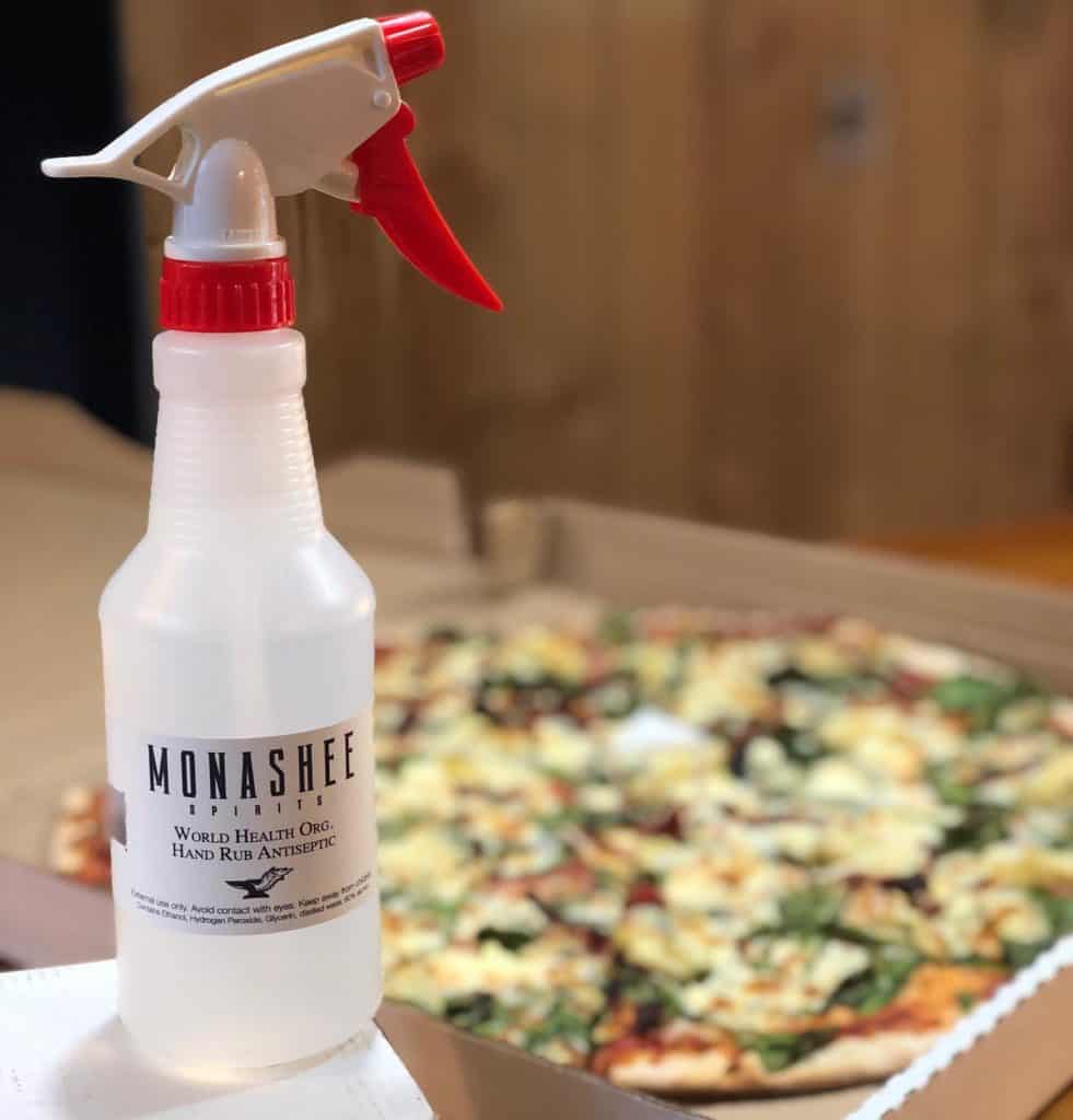 Nico’s Pizzeria using Monashee Spirits sanitizer in their restaurant.