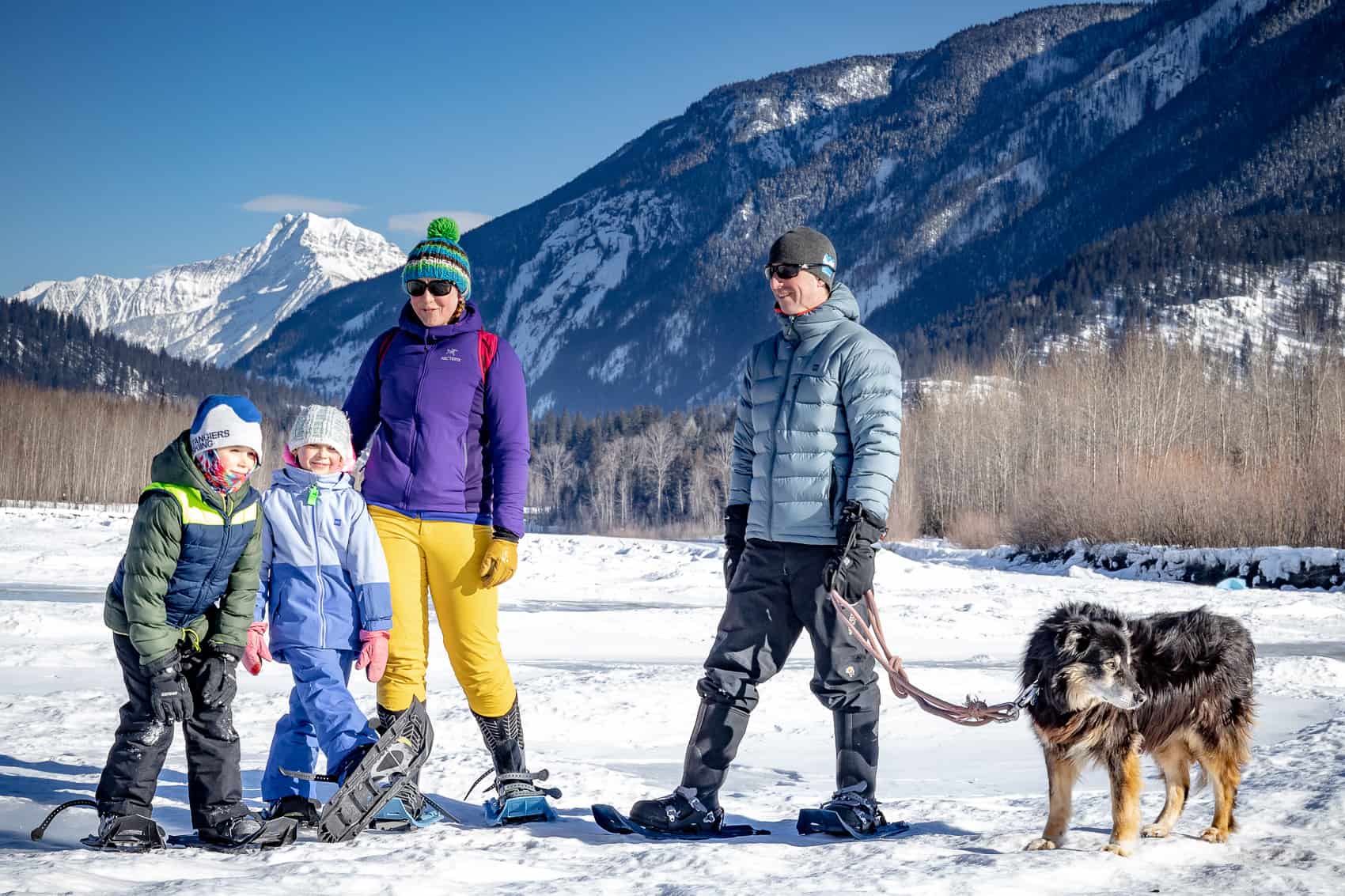 Family snowshoeing in sunny Revelstoke