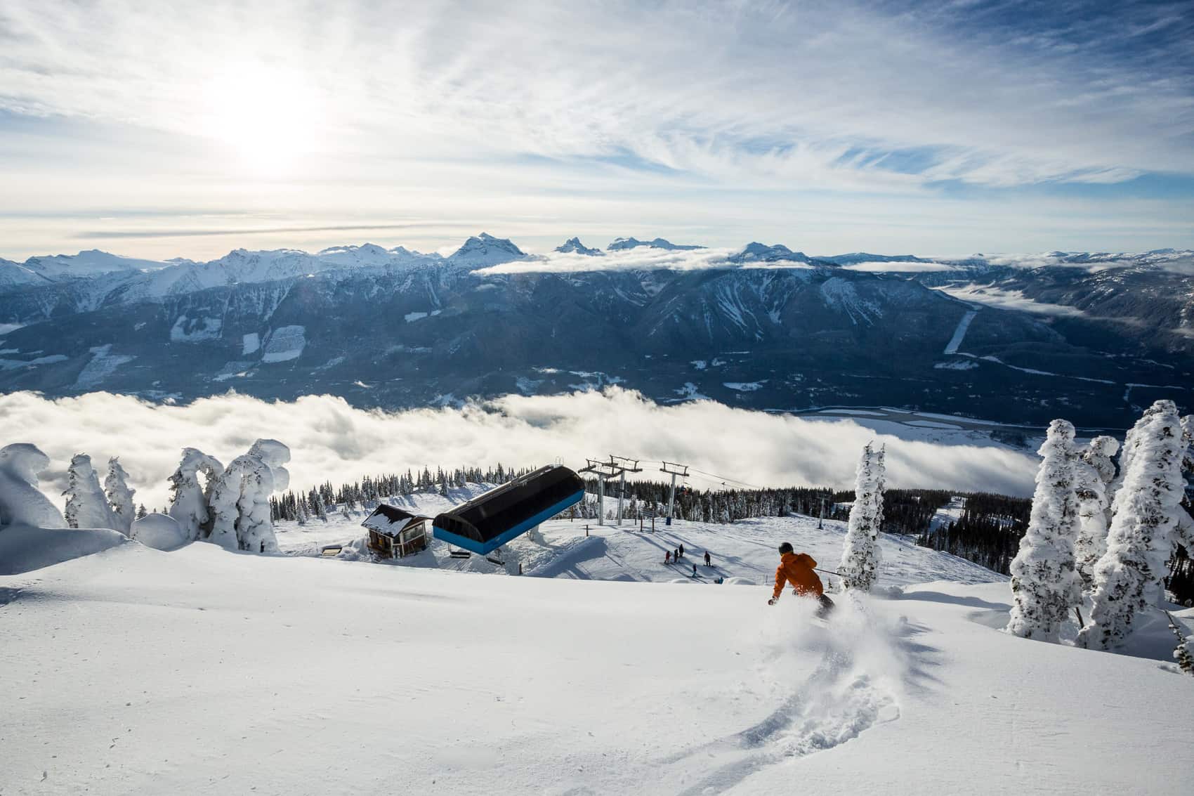 Skier descending with Mount Begbie