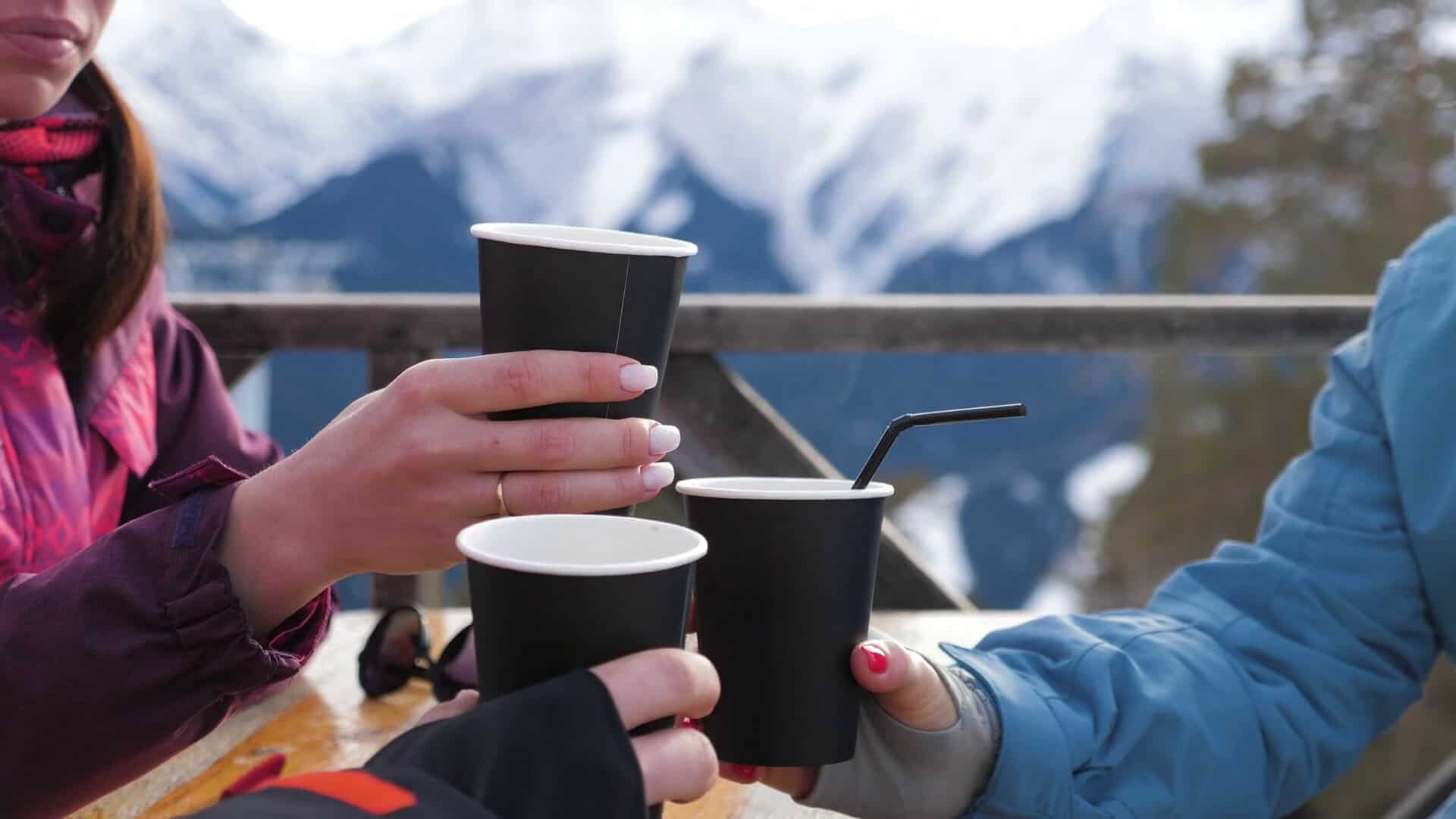 videoblocks-group-of-friends-enjoying-hot-tea-in-cafe-at-ski-resort-having-break-in-mountains-drinking-hot-coffee-after-skiing-winter-vacation-concept_bey8x2wel_thumbnail-1080_01