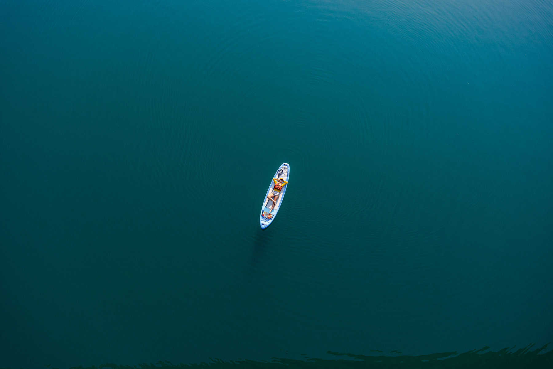 paddeboard in the middle of lake revelstoke