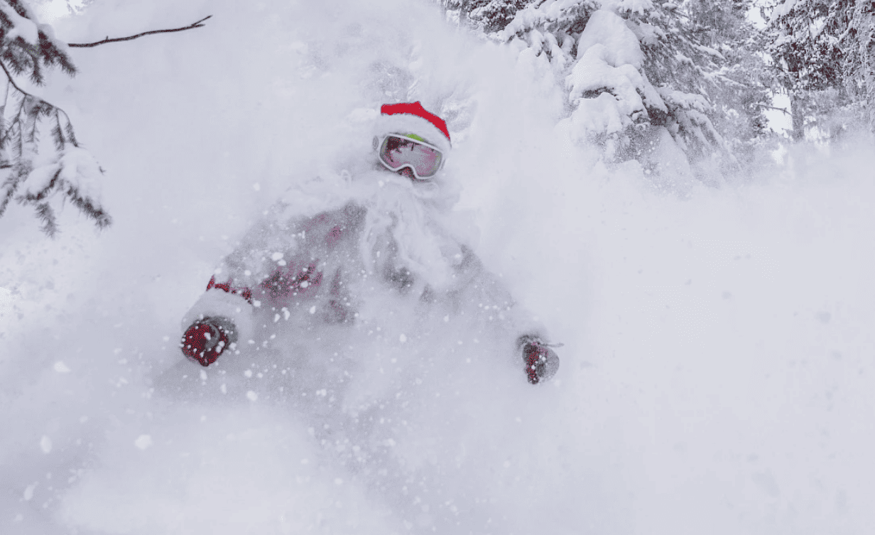 santa skiing through powder