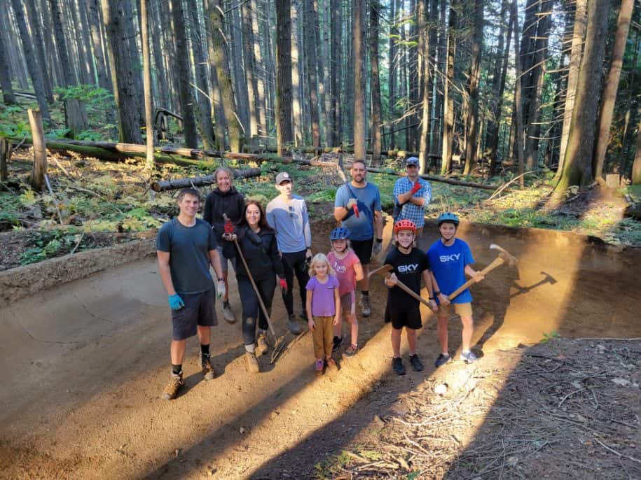 group picture located on mountain biking berm